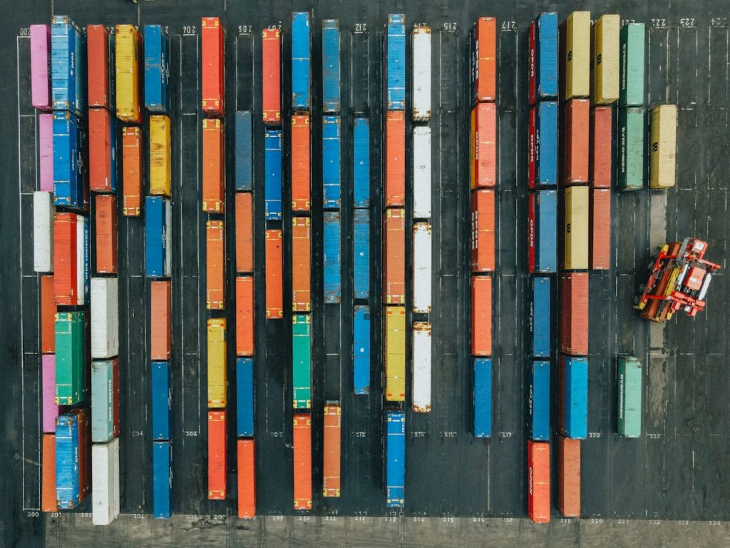 Crafting Captivating Headlines: Your awesome post title goes here Aerial shot of colorful cargo containers in a logistics hub, Scotland.